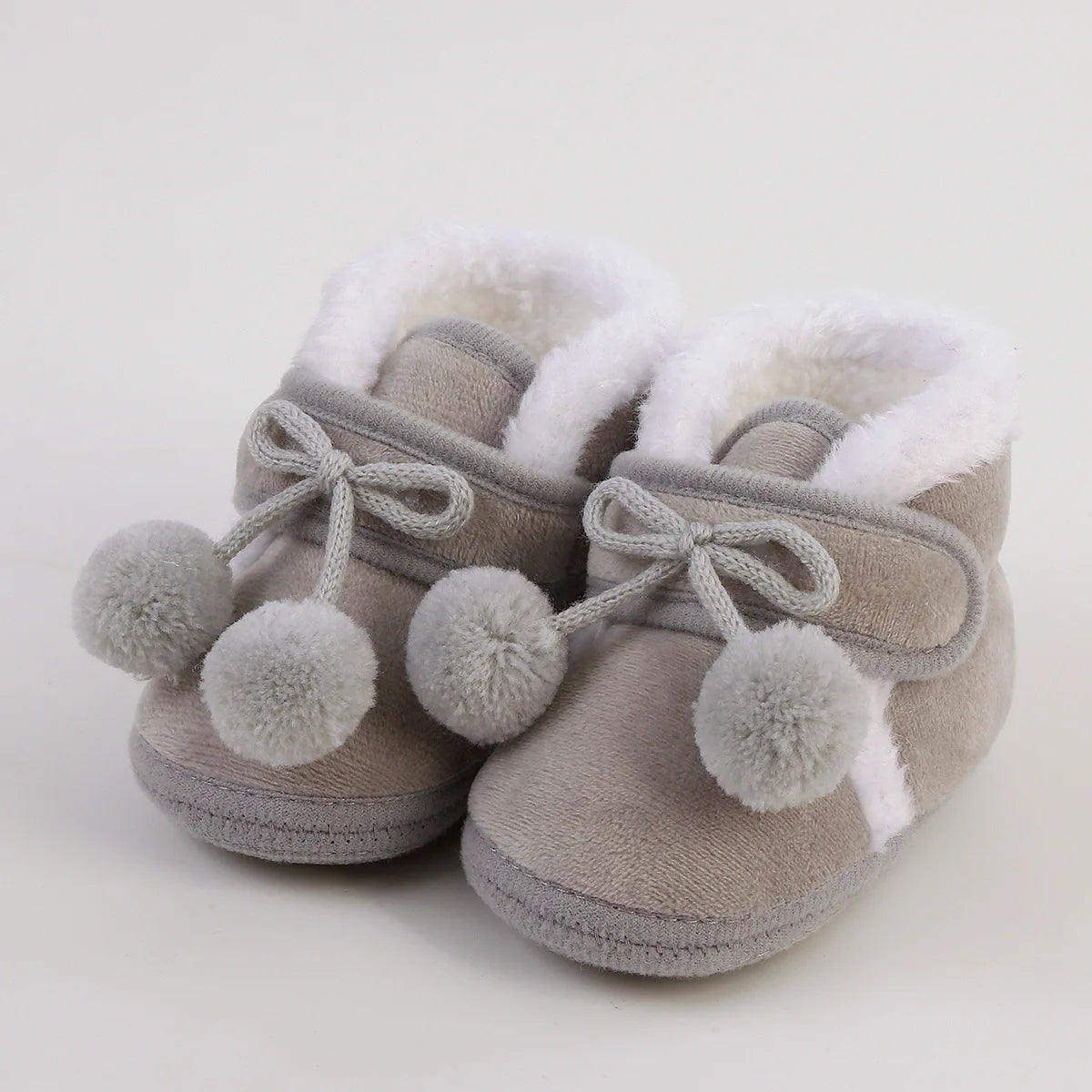Nouvelle mode chaussures confortables nouveau-né bébé filles garçons chaussons souples solide pompon bottes de neige infantile enfant en bas âge nouveau-né chaussures chauffantes