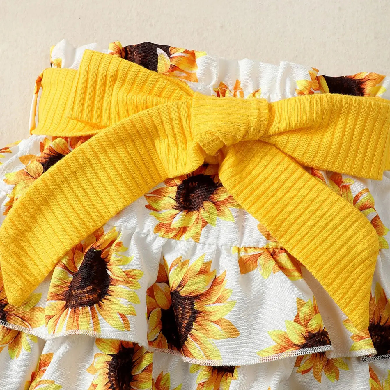 Tenue d’été bébé fille – Ensemble jaune motif tournesols avec jupe et bandeau