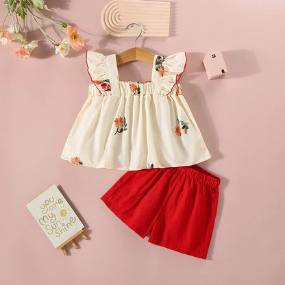 Ensemble d’été fille 2 pièces – Haut fleuri à manches courtes & short uni